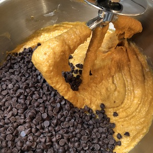 mini chocolate chips. being added to batter in bowl