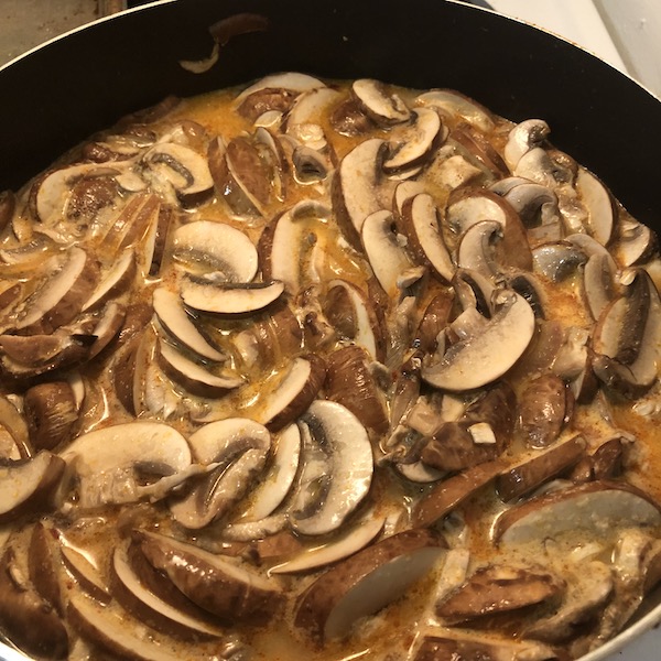 Soup with mushrooms simmering