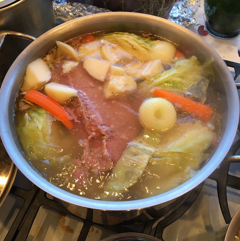 cabbage, carrots, cabbage, potatoes in a pot cooking