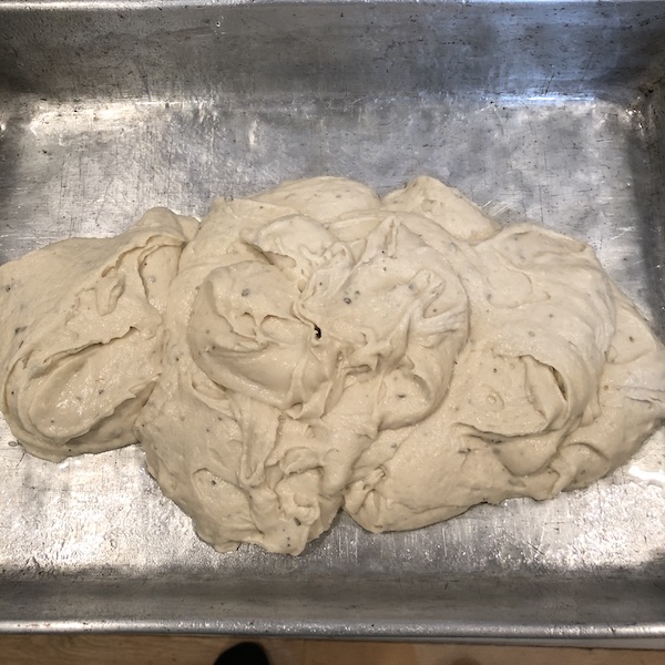 Dough in middle of 9x13 pan. Needs to be spread.