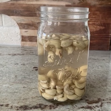 cashews soaking in a mason jar on the counter
