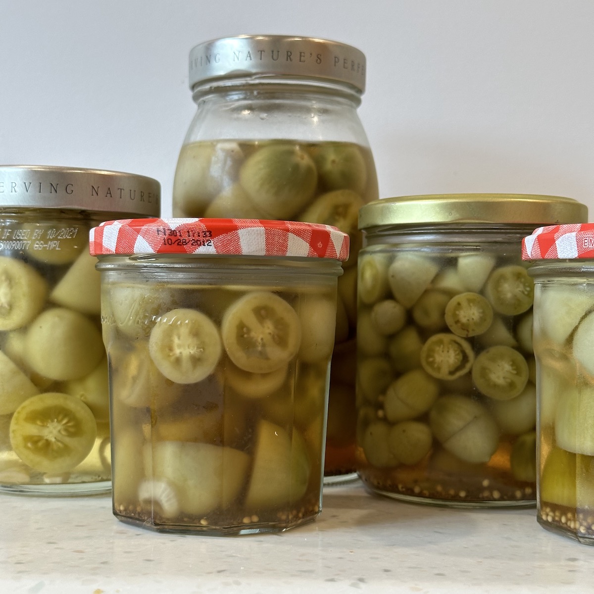 pickled tomatoes in jars