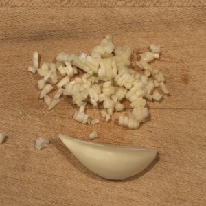 half clove garlic minced, half is whole