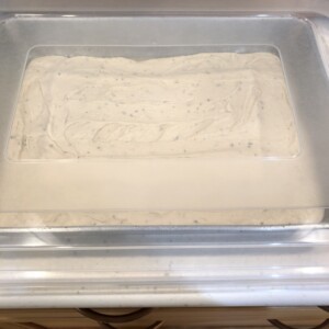 Dough rising in a pan under a cover